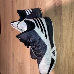 High top Adidas basketball shoes.